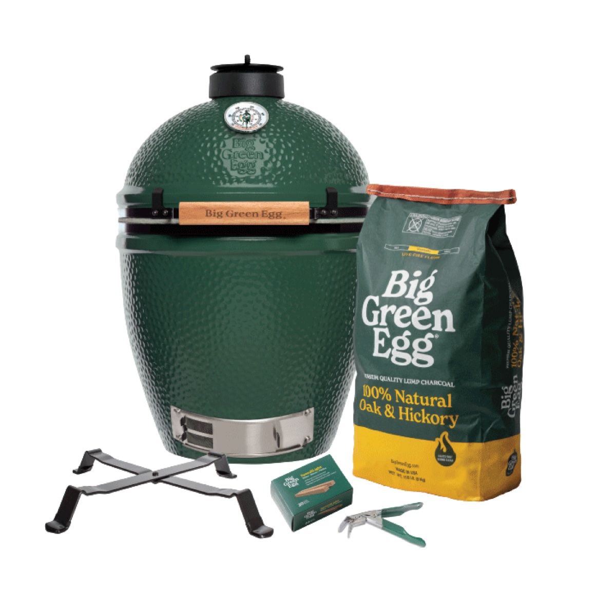 Big Green Egg Large Built-in Package on a white background: the green Large EGG with its metal Table Nest, a bag of lump charcoal, SpeediLight starters and the Grid Gripper