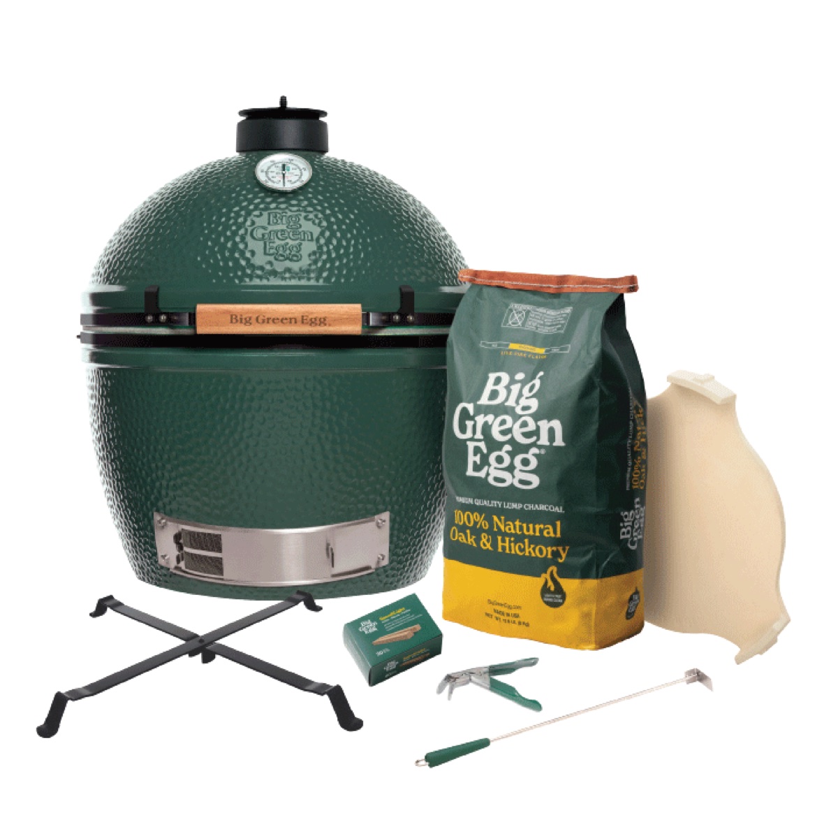 Big Green Egg XL Built-in Package on a white background: the green XL EGG with its metal Table Nest, convEGGtor, a bag of lump charcoal, SpeediLight starters and tools